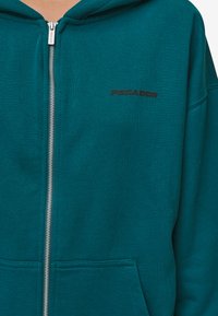 Pegador CLARITA OVERSIZED - Mikina so zipsom - washed urban turquoise,black gum
