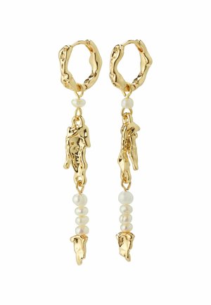 Aukso tono auskarai pasižymi tekstūruoto žiedo dizainu su kabamais elementais. Perlai suteikia kontrastą su lygiu, apvaliu pavidalu šalia organinių aukso akcentų.