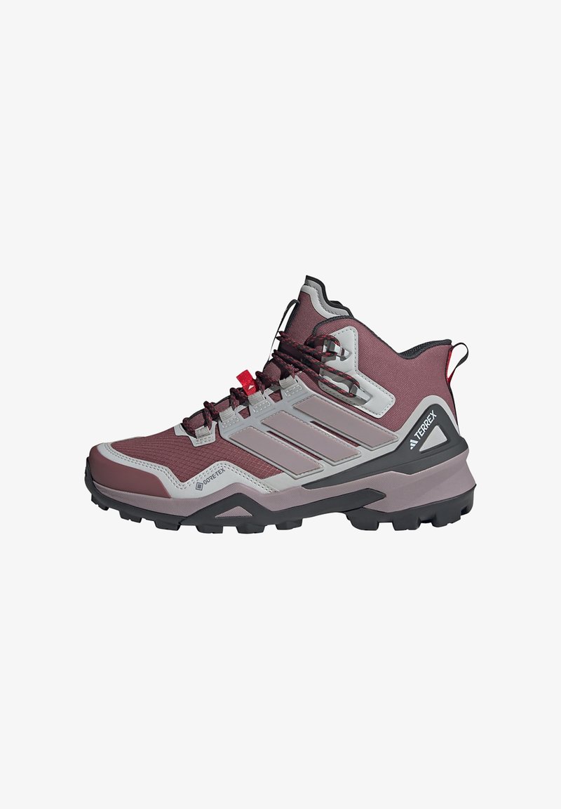 Sapatilhas de caminhada cano alto em bordô e cinza, com parte superior em Gore-Tex, sola em borracha e sistema de atilho durável com detalhes em vermelho.