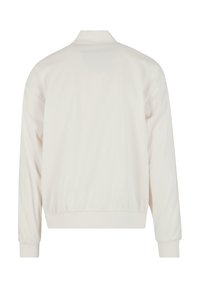 Giacca bomber leggera in crema con maniche lunghe, polsini e orlo a costine, texture liscia e design semplice senza decorazioni visibili.