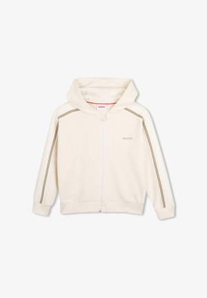 Sweat à capuche zippé couleur crème claire avec une finition texturée, présentant des bandes latérales en or et blanc cassé, et une capuche doublée d'un tissu doux.