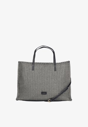 Sac cabas rectangulaire tissé noir et blanc avec poignées noires et une bandoulière réglable inclinée sur le côté droit.