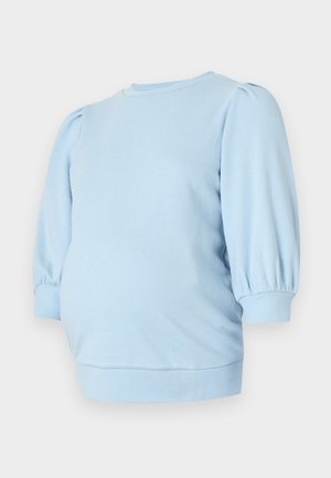 Hanorac de maternitate bleu deschis cu mâneci scurte umflate, guler rotund și tiv inferior strâmt. Tesătură moale și elastică.