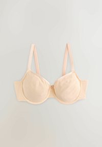 Soutien-gorge beige rembourré avec armatures, bretelles réglables, tissu lisse et fermeture dos à agrafes, posé à plat sur une surface claire.