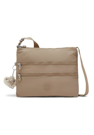 Borsa a tracolla beige con due tasche orizzontali con cerniera, tracolla regolabile, logo rotondo del marchio e un piccolo portachiavi a forma di scimmia in peluche.