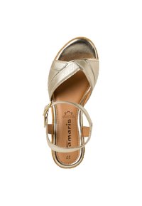 Golden strappy sandal with a metallic finish, crossband design, cushioned footbed, and an adjustable ankle strap. Size 37.