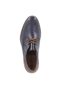 Navy blue perforated leather shoe with brown laces and a contrasting brown sole. Features a round toe and a textured insole.