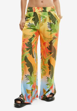 Pantaloni a gamba larga con stampa tropicale colorata. Realizzati in tessuto leggero con una cintura elastica. Presentano un vivace fogliame verde, arancione e giallo.