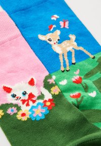 Knee-high socks featuring a split design: pink, blue, and green sections with embroidered images of a kitten, deer, and flowers.