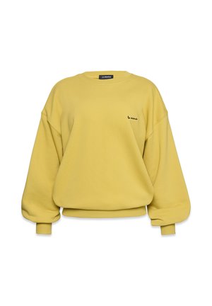 Żółta bluza z okrągłym dekoltem, w oversize'owym fasonie i ściągaczami przy nadgarstkach. Posiada czarny haftowany napis na lewej piersi. Miękka tekstura.