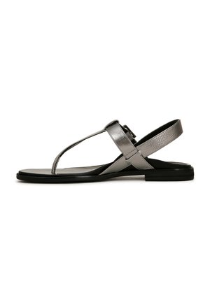 Silver metallic sandals with a T-strap design, cross buckles, and a flat black sole. Smooth texture with a simple, sleek silhouette.