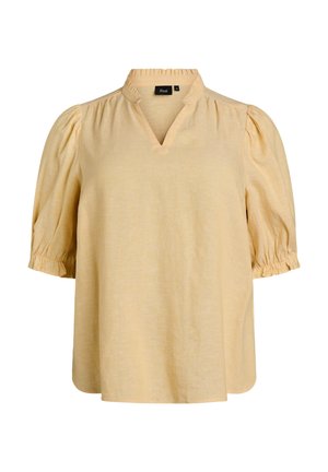 Blouse beige à manches courtes avec manches bouffantes froncées, col à volants, ouverture en V et coupe ample.