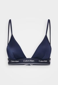 Dunkelblaue triangelförmige Bralette aus glattem Material, mit dünnen verstellbaren Trägern und einem Logo-Band mit weißen Akzenten.
