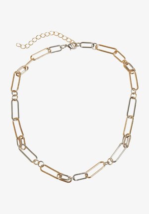 Zelta un sudraba ķēdes kaklarota ar savstarpēji savienotiem ovāliem gredzeniem, kas aprīkota ar astes aizdari un regulējamu ķēdi, lai nodrošinātu piemērotu izmēru.