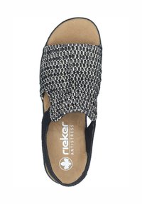 Black and white woven slide sandal with a soft, textured upper, cushioned insole, and Rieker Antistress logo on the footbed.