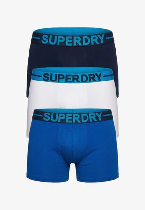 Lot de trois boxers hommes en marine, blanc et bleu avec des ceintures élastiques bleues portant le logo "SUPERDRY" en couleurs contrastées.