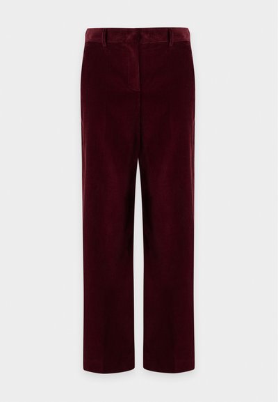 Pantalon en velours côtelé bordeaux coupe droite avec passants de ceinture et fermeture éclair sur le devant, présenté sur un fond clair uni.