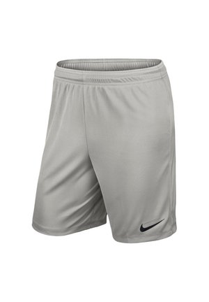 Short de sport gris clair avec une ceinture élastique et un petit logo Nike Swoosh noir sur la partie inférieure de la jambe gauche.