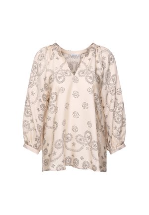 Beige blouse met lange mouwen, versierd met zwarte bloem- en paisleypatronen, V-halslijn en lichte fronsen bij de schouders en manchetten.