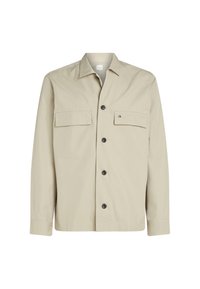 Giacca beige con bottoni, realizzata in misto cotone, con due tasche sul petto, colletto e bottoni neri. Dettaglio sottile del logo sulla tasca.