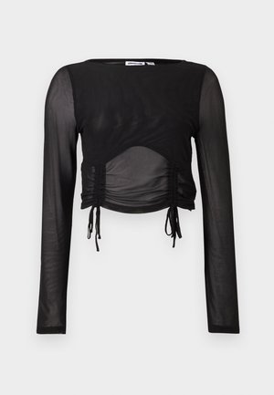 Top cropped preto de mangas longas com tecido transparente, detalhes franzidos nos lados e cordões ajustáveis na barra. Textura suave em toda a peça.