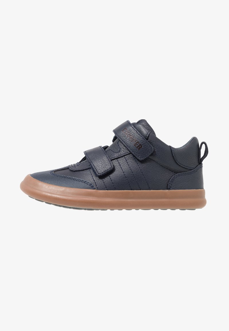 Dark blue leather sneakers with two black Velcro straps, rubber tan sole, textured sides, and a round toe design.
