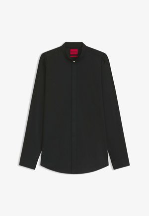 Zwarte blouse met lange mouwen, kenmerkende mandarin kraag, knoopsluiting aan de voorkant en een strakke uitstraling. Gemaakt van een soepele stof met een gestructureerde pasvorm.