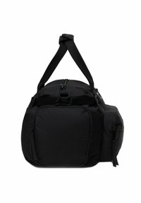 Borsa duffel nera con tasche con zip sul fronte e sul lato, chiusura superiore con zip e doppi manici annodati insieme.