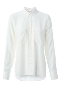 Chemise blanche à manches longues en tissu léger, avec une surface texturée, une fermeture boutonnée à l'avant et deux poches poitrine.