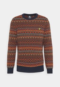 Rundhalsad tröja med orange, bruna och marinblå geometriska mönster och en liten gul fågellogo på bröstet, långa ärmar, marinblå muddarna och nederkant.