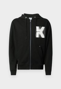 Μαύρο φούτερ με φερμουάρ, με μπροστινή τσέπη, κουκούλα με κορδόνι και λευκό γραφικό λογότυπο στο αριστερό στήθος με γραμμικές τονισμένες λεπτομέρειες. Υλικό από βαμβακερό μείγμα.