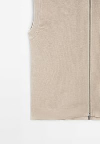 Beige ärmellose Strickweste mit einem Reißverschluss vorne. Strukturierter Stoff, gerippte Ränder und großzügige Armausschnitte. Minimalistisches Design.