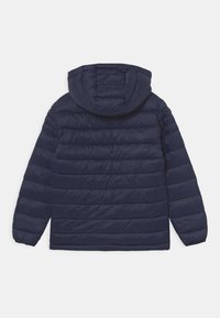 Navy blue padded jacket with a hood, featuring horizontal quilted sections, elastic cuffs, and a straight hem. Lightweight material.