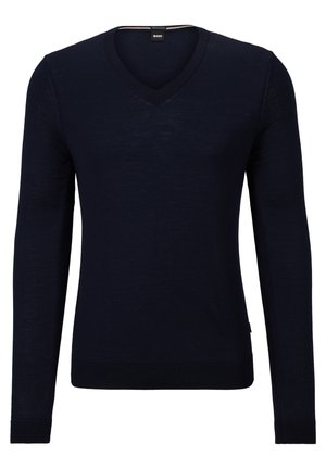 Maglione blu navy a scollo a V realizzato in morbido tessuto a maglia, con maniche lunghe e polsini e orlo a coste. Presenta un'etichetta con il logo del marchio all'interno del collo.