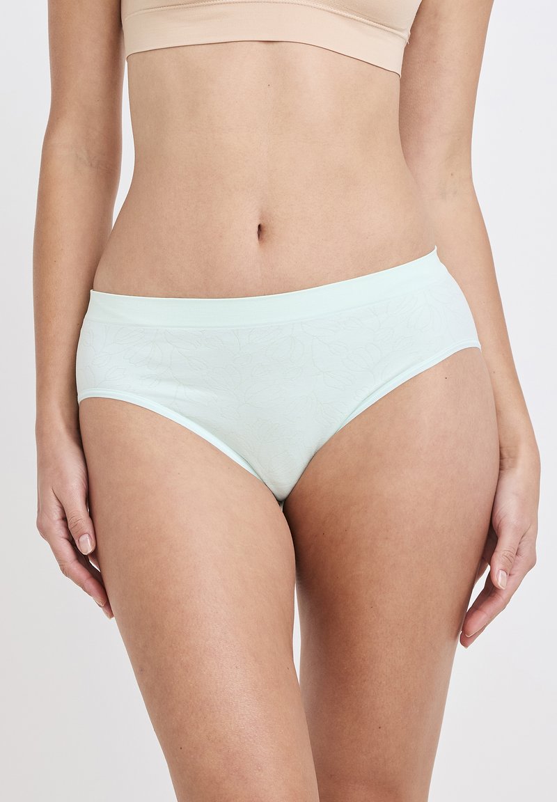 Mintgrön bomullsunderdel med en mjuk, slät textur och subtilt blommönster. Har en bekväm midjeresår och en måttlig täckande design.