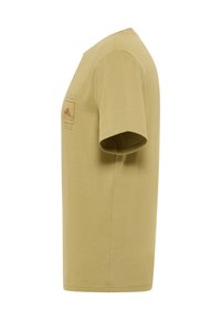 Side view of a short-sleeve beige t-shirt with a printed graphic and text on the chest.