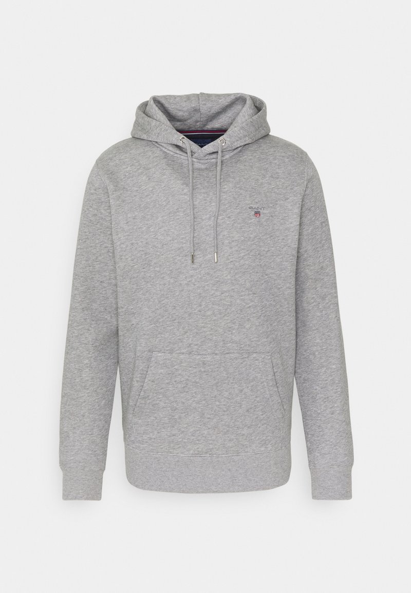 Graue Hoodie aus weichem Stoff mit einer Vordertasche, gerippten Bündchen, Kapuze mit Kordelzug und einem kleinen Logo auf der Brust.