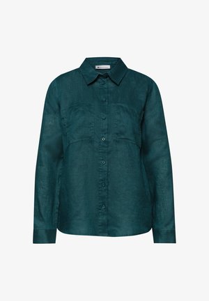 Mørk teal langærmet skjorte med knapper, krave og to brystlommer, lavet af let tekstureret stof.