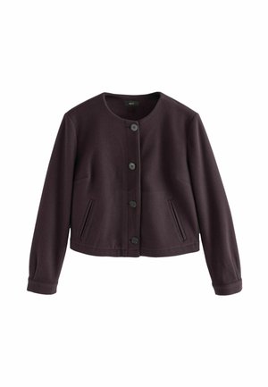 Kurze lila Jacke aus glattem Stoff mit rundem Ausschnitt, sechs schwarzen Knöpfen und zwei vorderen Taschen. Lange Ärmel mit enganliegenden Bündchen.