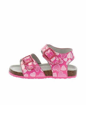 Sandalo rosa per bambini con motivi a cuori bianchi, due cinturini regolabili con fibbia, suola in sughero e soletta imbottita grigia.