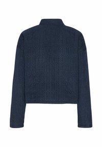 Navy cropped jacket with long sleeves, featuring textured stitching and small perforations in a geometric pattern across the fabric.