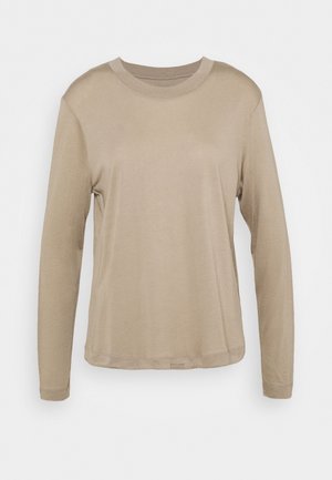 Beige long-sleeve crew neck shirt with a relaxed fit and simple design on a white background.