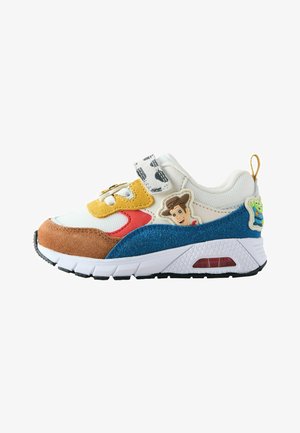 Children's sneaker with white, brown, yellow, red, and blue panels, featuring Toy Story character patches and a Velcro strap.