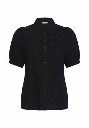 Must lühikeste varrukatega pluus, õhuliste varrukatega, tekstuurse lillmustriga, nööpidega ees ja terava kraega.