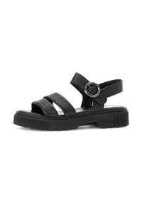 Black sandals with three wide straps, a circular buckle accent on the ankle strap, and a thick, textured sole.