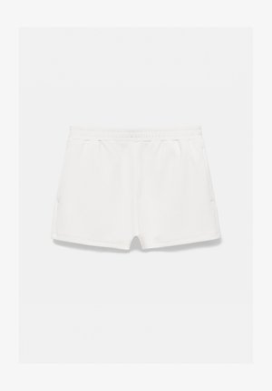 Hvide elastiske taljeshorts med sidelommer, lavet af blødt stof, vist på en lys baggrund.