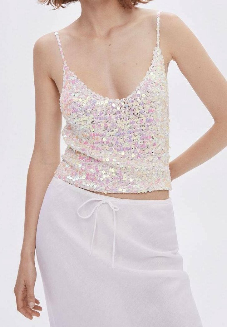Camisole à sequins dans des tons pastel avec un profond décolleté en V et de fines bretelles. Elle présente une coupe ajustée et une surface texturée et scintillante.