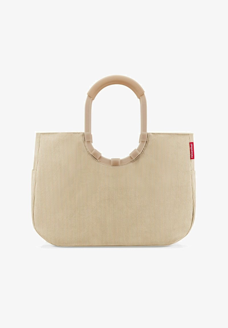 Beige corduroy tote bag with a rounded plastic handle. Features vertical ribbed texture and side pocket, branded with a red tag.