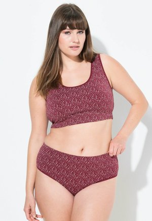 Bralette bordeaux e slip a vita alta, con un motivo a macchie bianche. Tessuto morbido, cintura elastica e scollatura a girocollo sulla parte superiore.