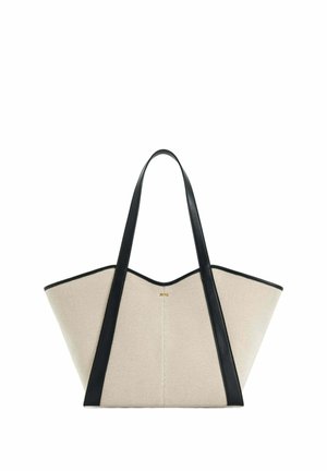 Sac fourre-tout en toile beige de forme trapézoïdale large, bordé de cuir noir, avec deux longues poignées en cuir noir.